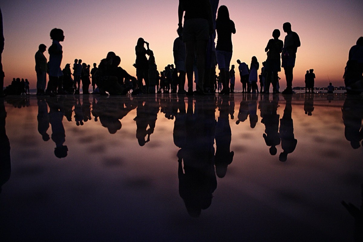 Friends gathered at sunset, the kind of group that loves a rap duet