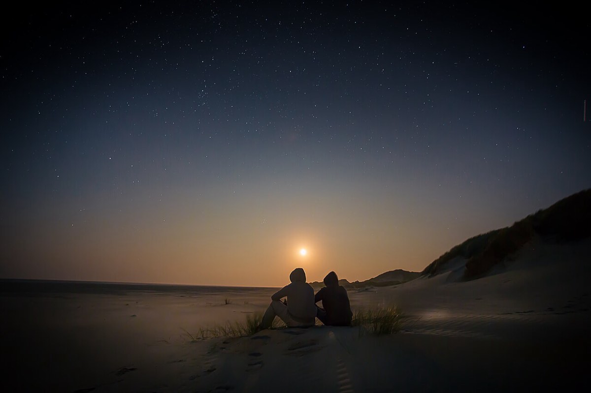 A couple watching the sunset together