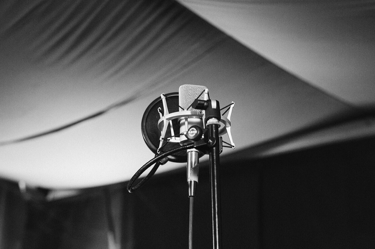 A single mic under the lights: every roast needs a stage
